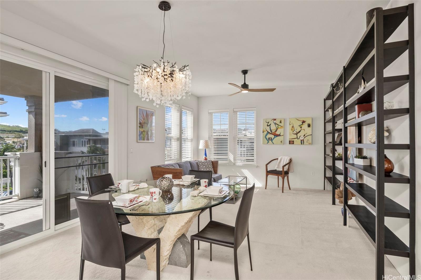 520 Lunalilo Home Road, Unit 8416 Honolulu, HI 96825 - Photo 1 of 1 a view of a dining room with furniture and a chandelier