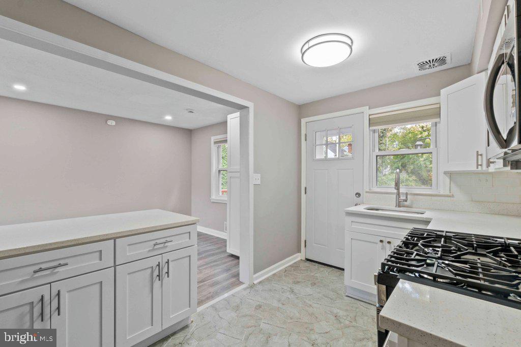 6307 Fairdel Avenue Baltimore, MD 21206 - Photo 14 of 36 a kitchen with a sink and cabinets