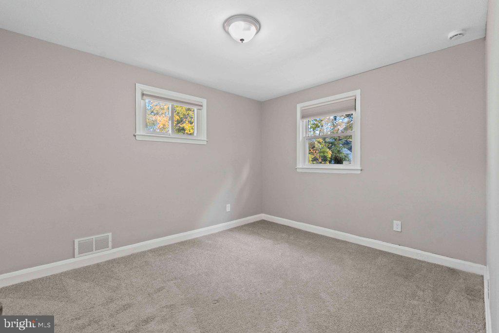 6307 Fairdel Avenue Baltimore, MD 21206 - Photo 18 of 36 an empty room with windows
