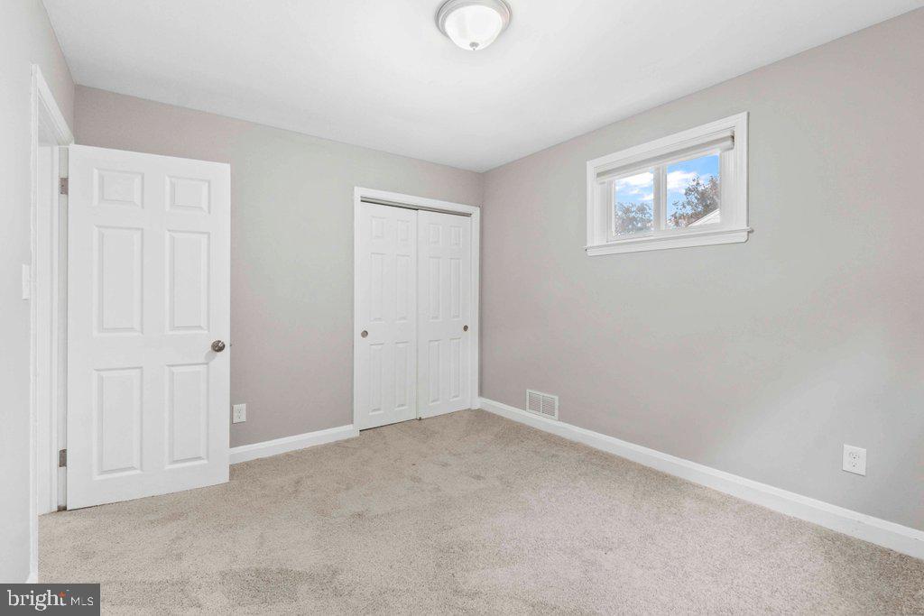 6307 Fairdel Avenue Baltimore, MD 21206 - Photo 19 of 36 an empty room with windows and closet