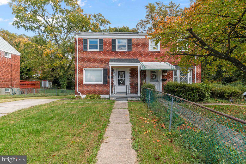 6307 Fairdel Avenue Baltimore, MD 21206 - Photo 2 of 36 a front view of a house with yard