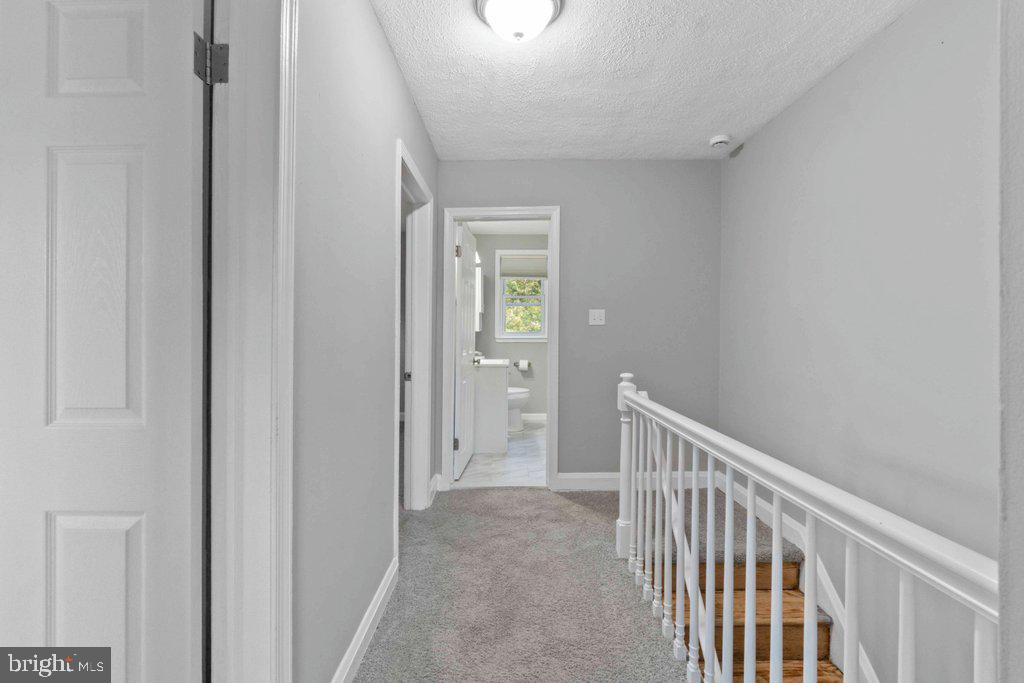 6307 Fairdel Avenue Baltimore, MD 21206 - Photo 24 of 36 a view of a hallway with wooden floor and entryway