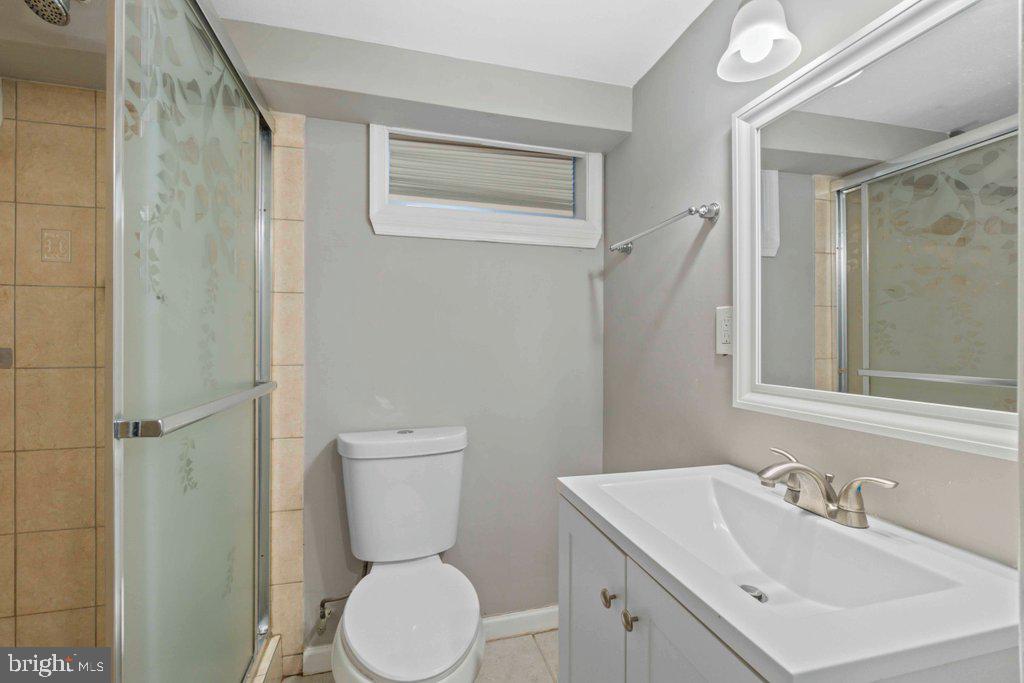 6307 Fairdel Avenue Baltimore, MD 21206 - Photo 27 of 36 a bathroom with a toilet sink and mirror