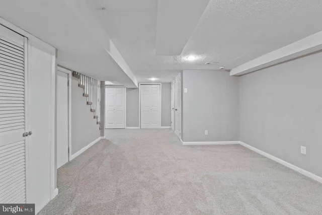 a balcony with wooden floor and trees