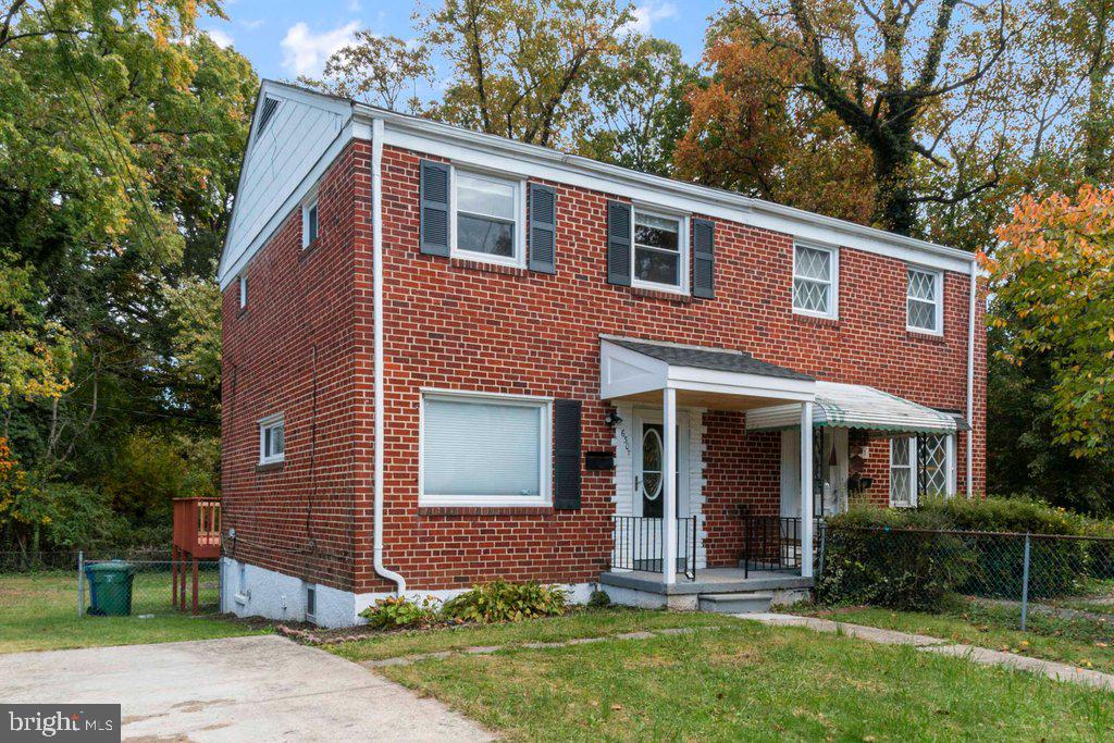 6307 Fairdel Avenue Baltimore, MD 21206 - Photo 3 of 36 a front view of a house with a yard
