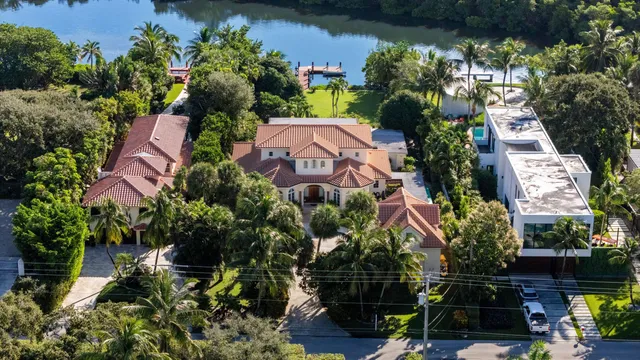 an aerial view of a houses with yard