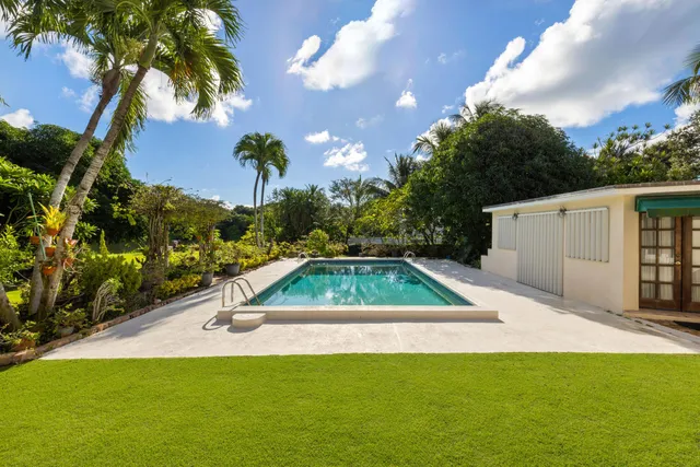 a view of swimming pool with a yard