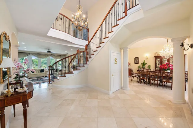 a view of entryway and hall with dining room