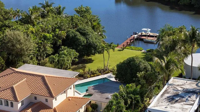 an aerial view of a house with outdoor space