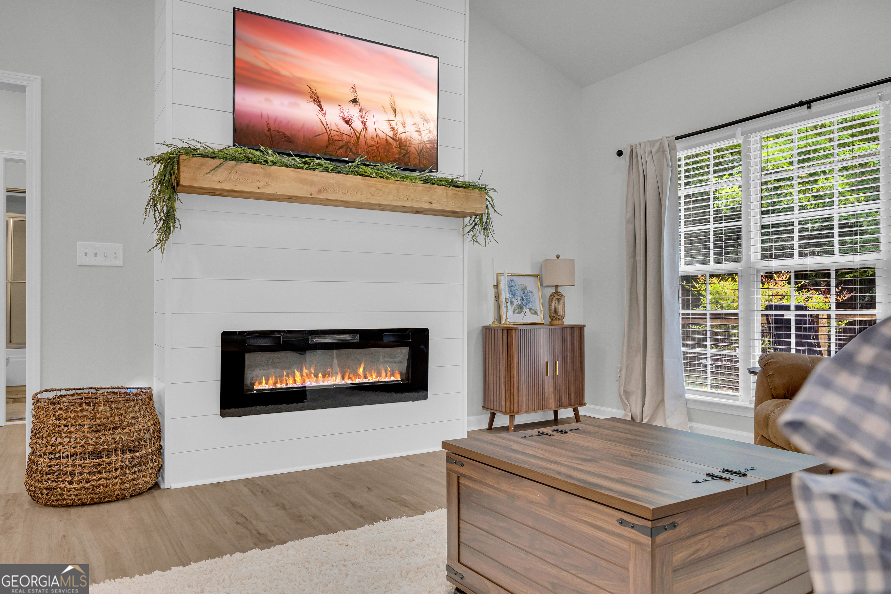 163 Tuxedo Drive Commerce, GA 30530 - Photo 21 of 62 a living room with furniture and a fireplace