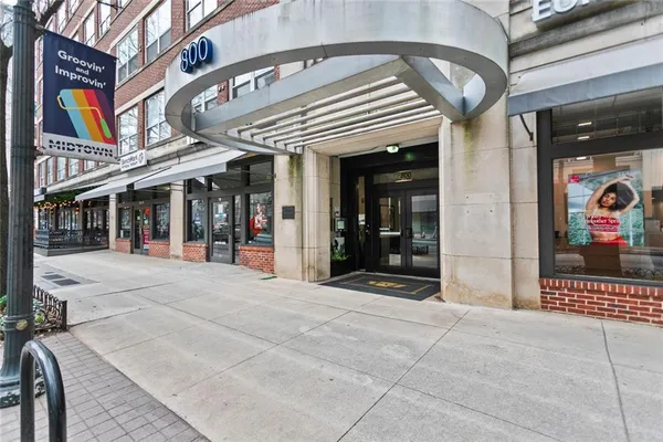 a view of a building with retail shops