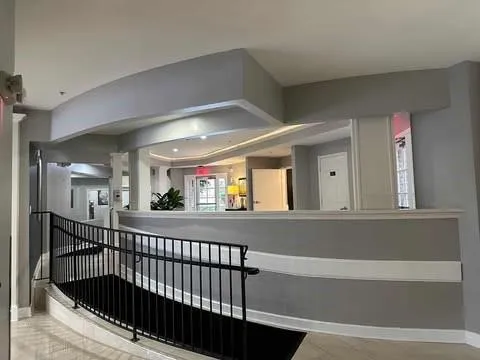 a view of a swimming pool with outdoor seating