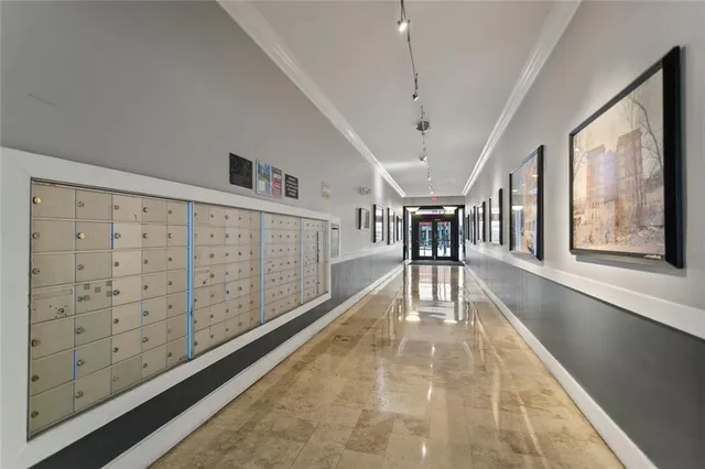 a view of gallery with wooden floor