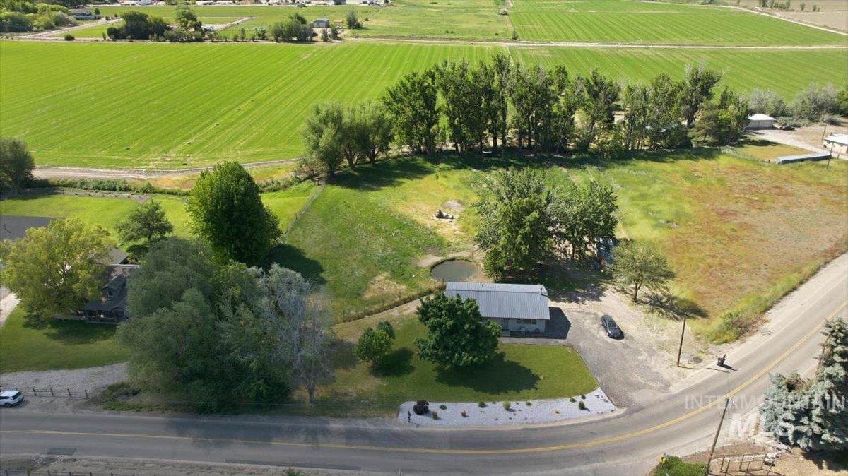 6323 Foothill Road Star, ID 83669 - Photo 43 of 50 Expansive rural property featuring multiple structures, mature trees, a small pond, and abundant green space