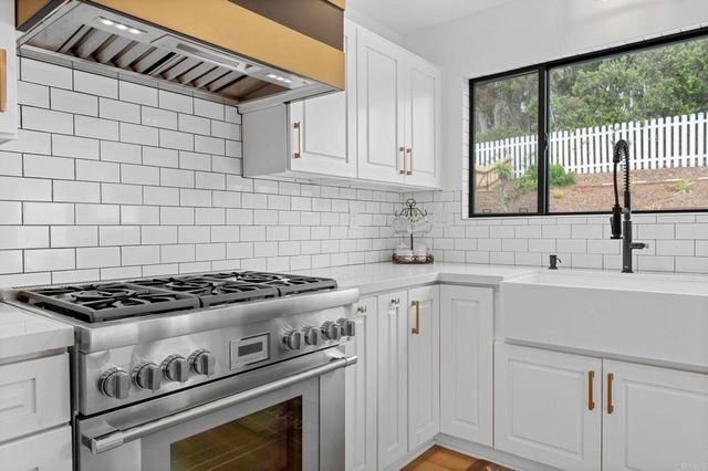 a bathroom with a sink toilet and mirror