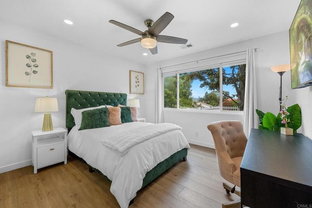 a view of a garden with wooden fence