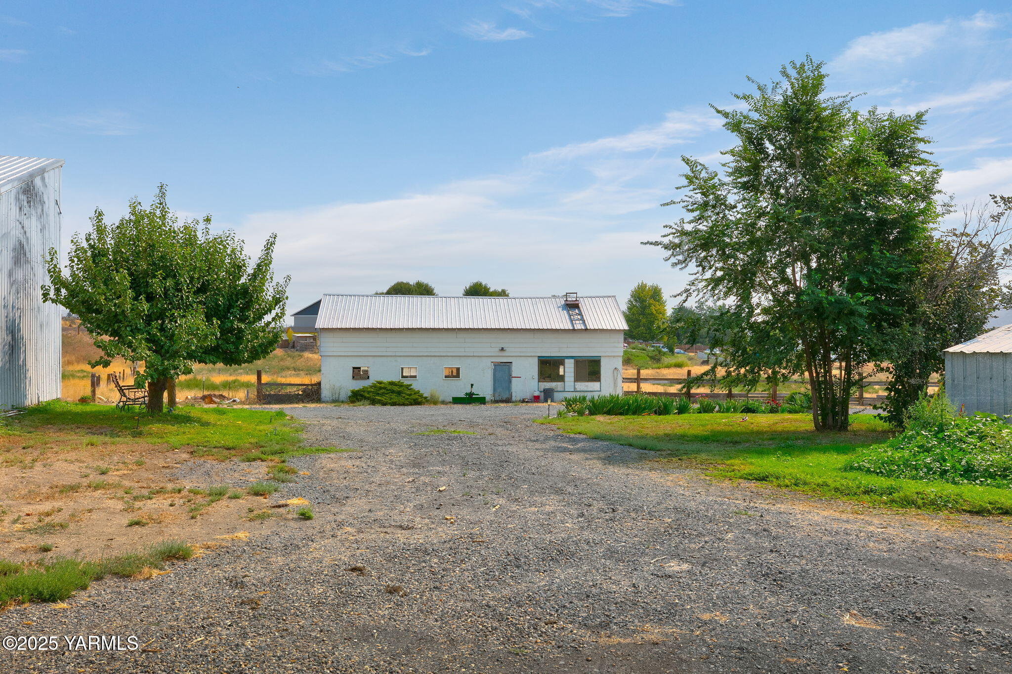 8351 North Wenas Road Selah, WA 98942 - Photo 5 of 26 a view of a house with a yard and tree s