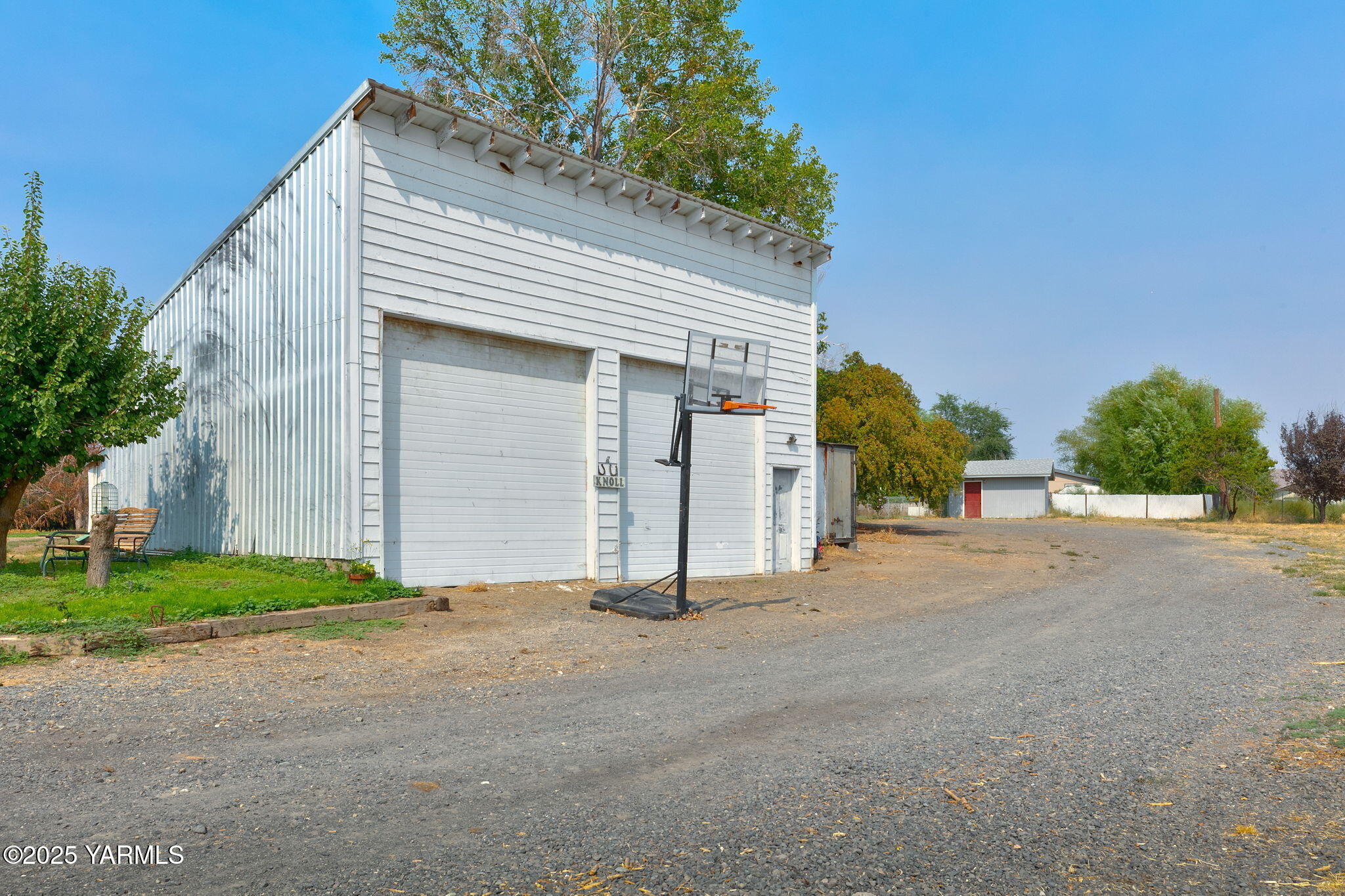 8351 North Wenas Road Selah, WA 98942 - Photo 6 of 26 a view of a house with a yard and garage