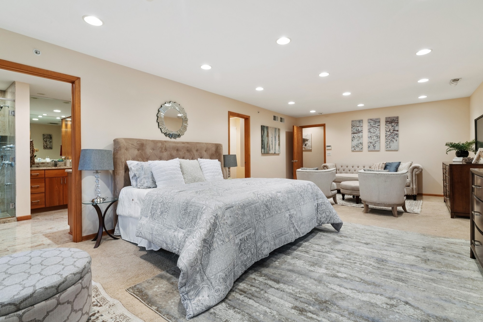 2037 Clover Road Northbrook, IL 60062 - Photo 13 of 29 a spacious bedroom with a bed a table and a couch