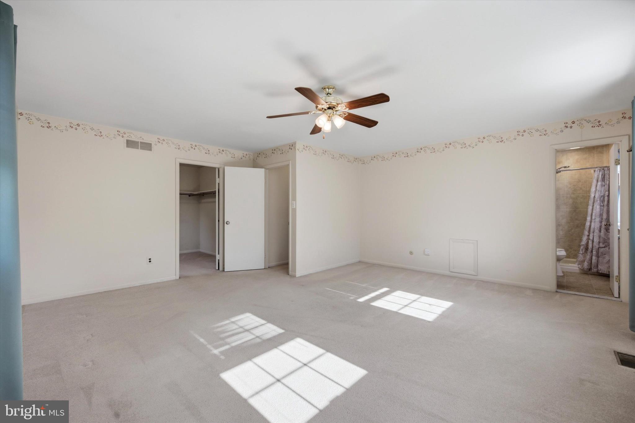 1965 Foster Road Hatfield, PA 19440 - Photo 28 of 38 a view of an empty room with a ceiling fan and a window