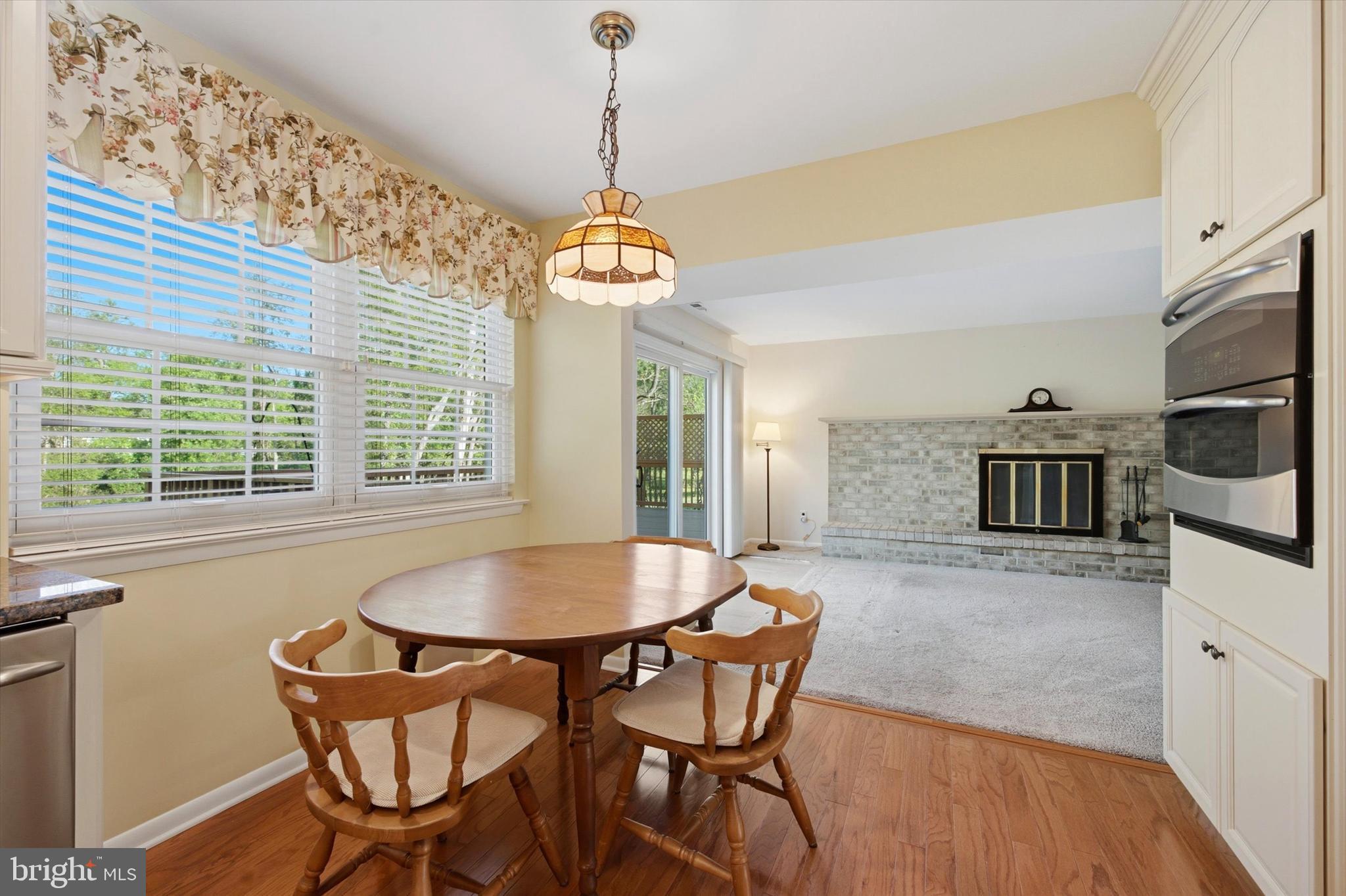 1965 Foster Road Hatfield, PA 19440 - Photo 5 of 38 a dining room with furniture a chandelier and wooden floor