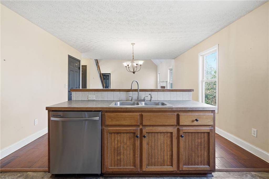 27 Larsen Ridge Adairsville, GA 30103 - Photo 15 of 47 a bathroom with a granite countertop sink a mirror and a