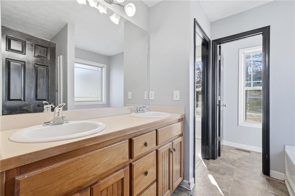 27 Larsen Ridge Adairsville, GA 30103 - Photo 20 of 47 a bathroom with a sink double vanity and a mirror