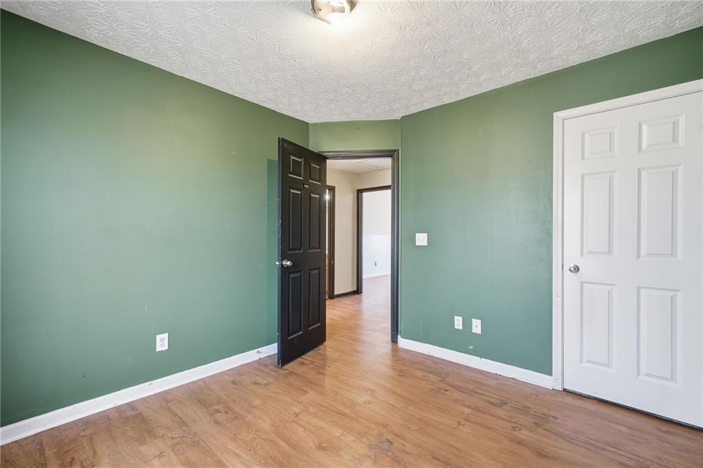27 Larsen Ridge Adairsville, GA 30103 - Photo 27 of 47 an empty room with wooden floor and closet