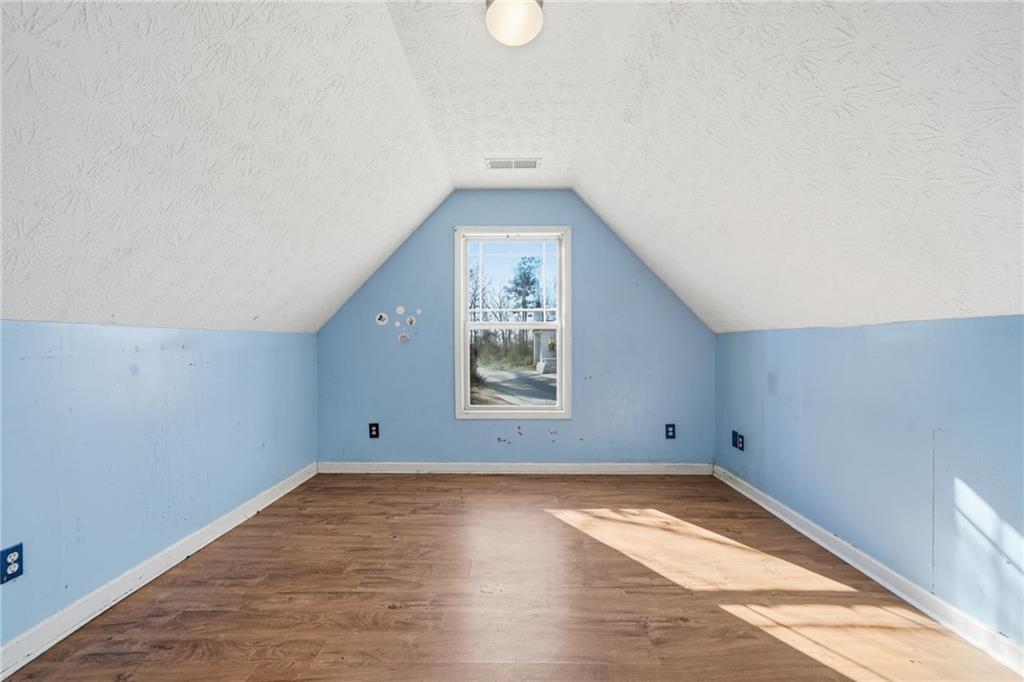 27 Larsen Ridge Adairsville, GA 30103 - Photo 28 of 47 an empty room with wooden floor and windows