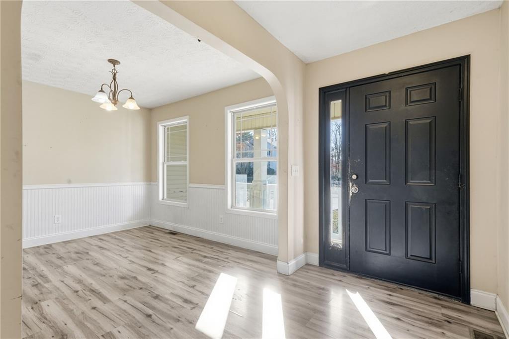 27 Larsen Ridge Adairsville, GA 30103 - Photo 3 of 47 a view of an empty room with wooden floor and a window