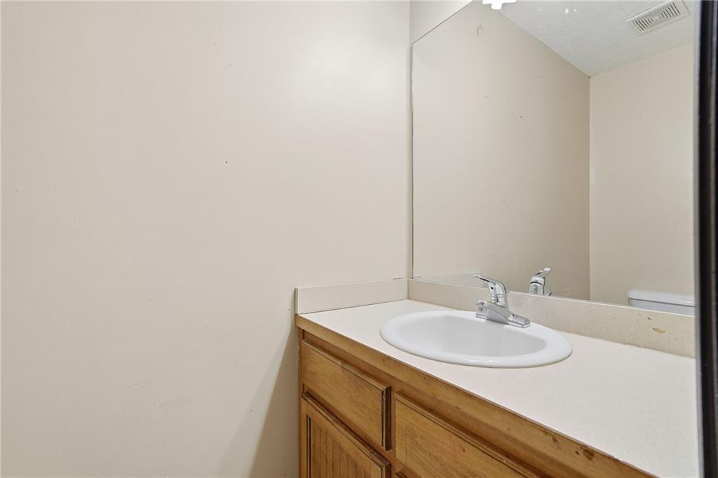 27 Larsen Ridge Adairsville, GA 30103 - Photo 31 of 47 a bathroom with a sink and a mirror