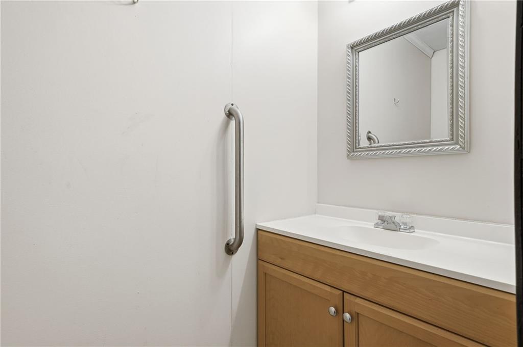 27 Larsen Ridge Adairsville, GA 30103 - Photo 34 of 47 a bathroom with a sink and a mirror