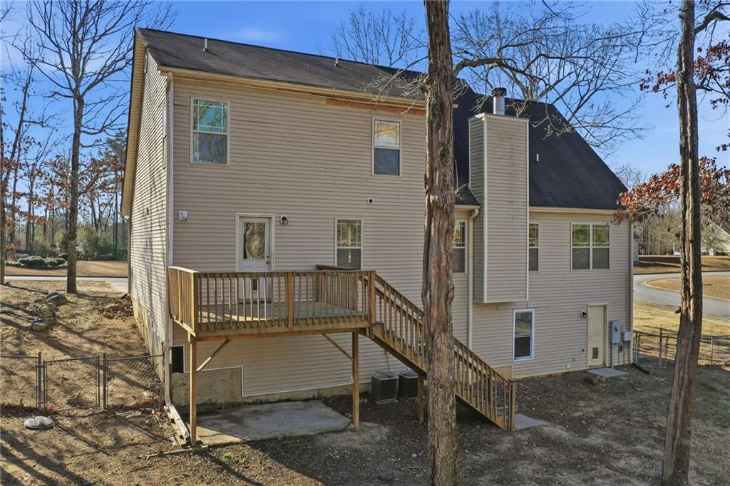 27 Larsen Ridge Adairsville, GA 30103 - Photo 38 of 47 a view of a house with a small yard and wooden fence