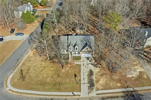 a aerial view of a house with a yard