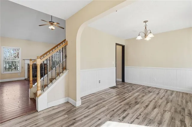 a view of an entryway with wooden floor