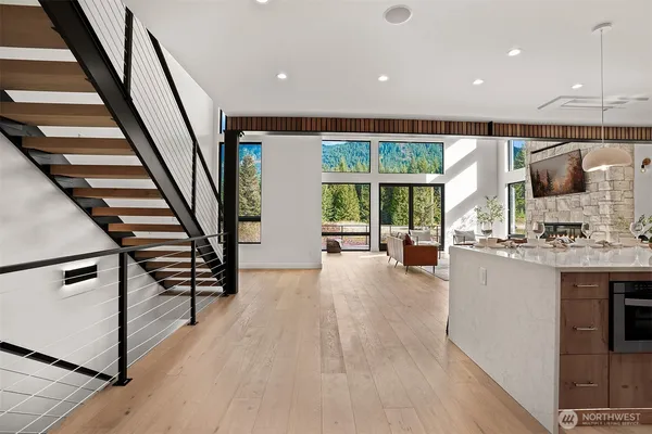 a view of living room with furniture and large window