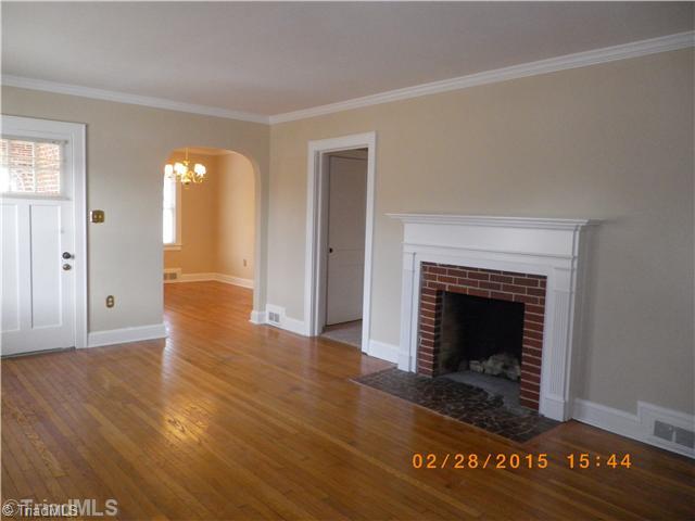 3372 Country Club Road Winston-Salem, NC 27104 - Photo 9 of 16 Living Room. Living room with wood burning fireplace.