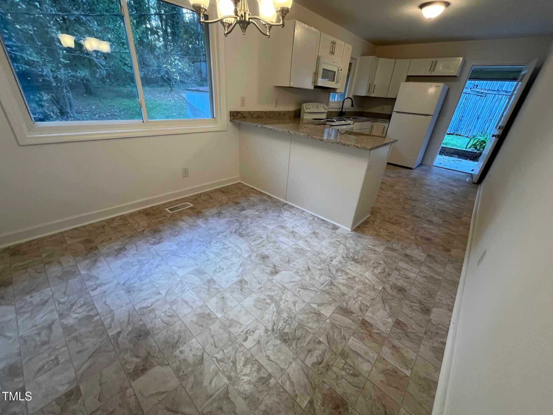 916 Forge Road Durham, NC 27713 - Photo 12 of 55 Kitchen Side Door from Dining
