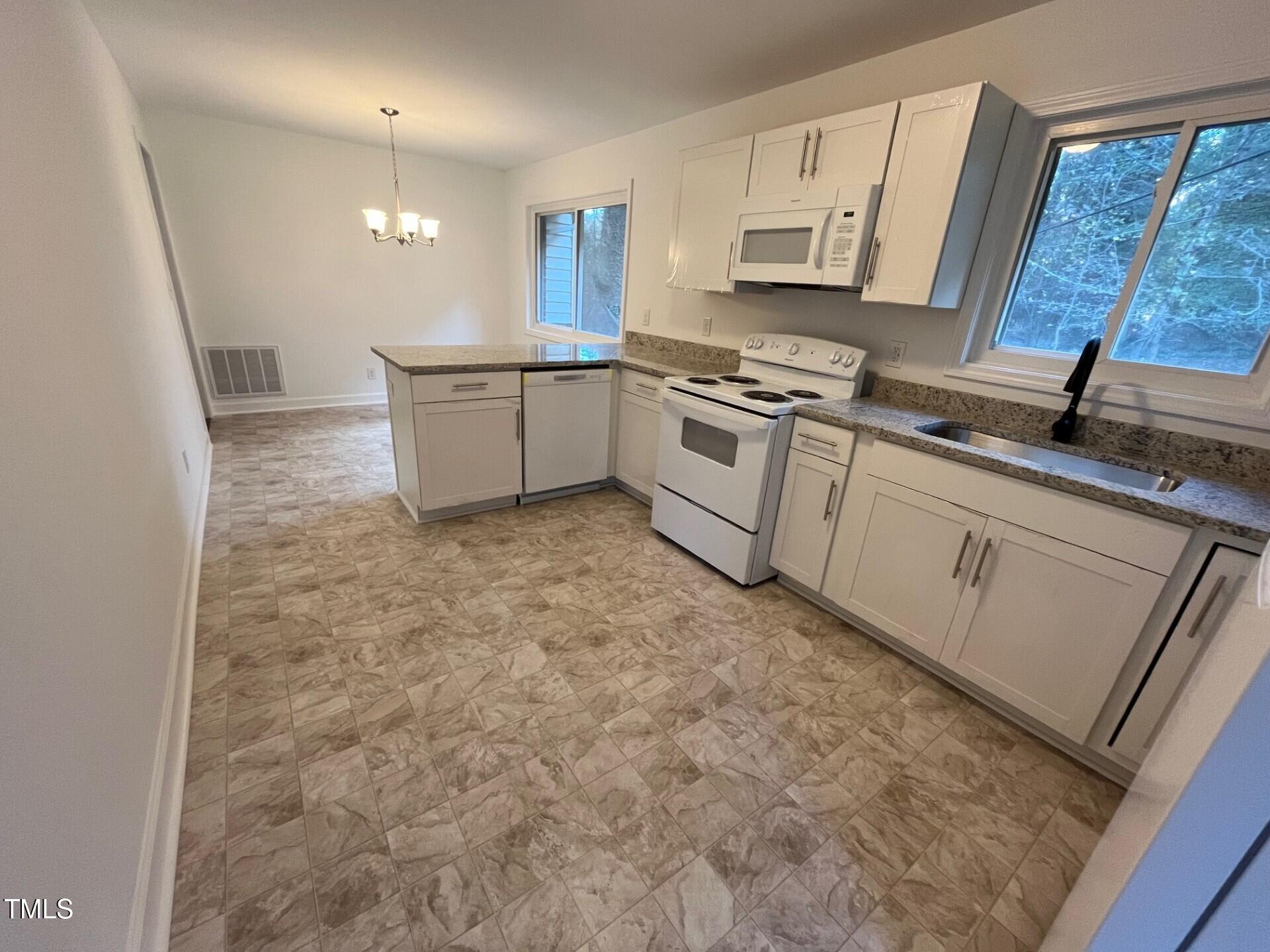 916 Forge Road Durham, NC 27713 - Photo 14 of 55 Kitchen to Dining