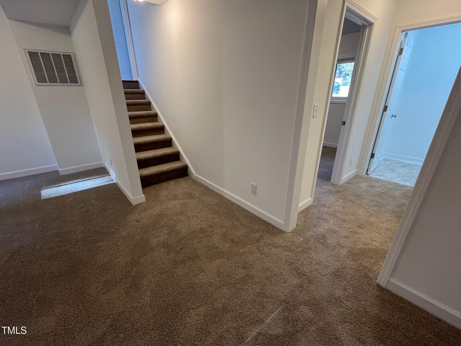 916 Forge Road Durham, NC 27713 - Photo 30 of 55 Basement Stairs Up & Hall