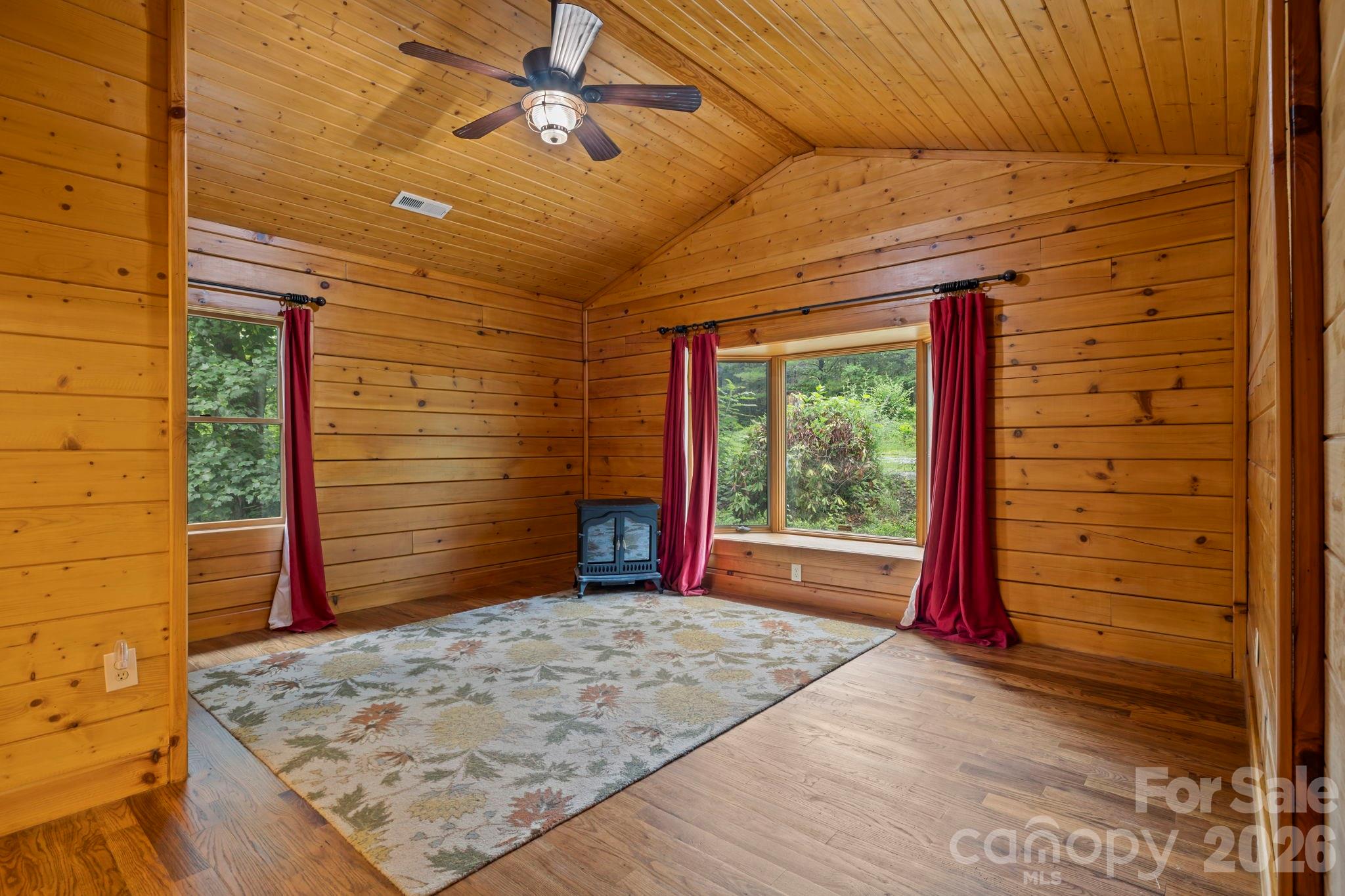 266 Rhododendron Drive Saluda, NC 28773 - Photo 13 of 35 a view of a porch with a backyard