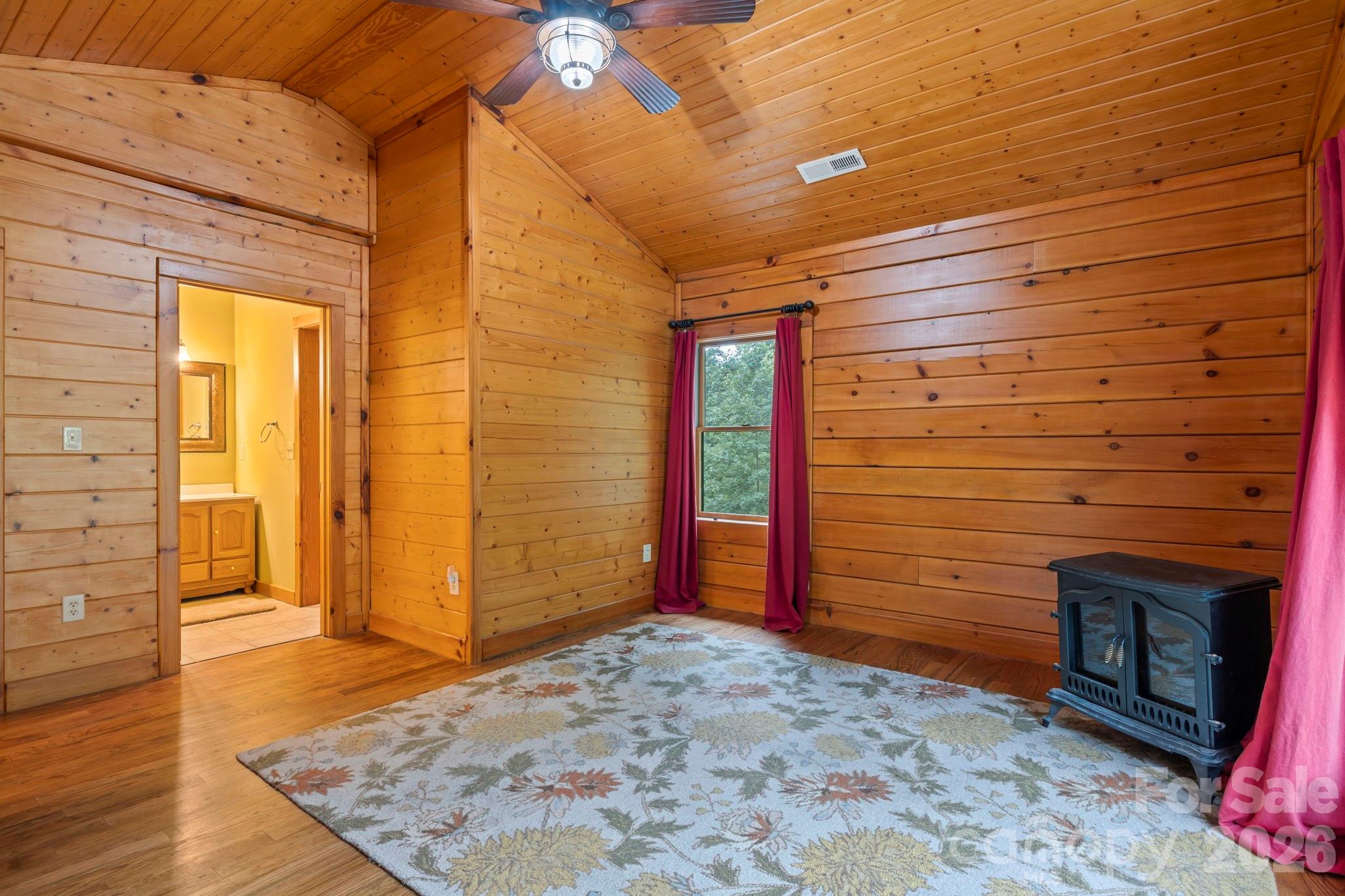 266 Rhododendron Drive Saluda, NC 28773 - Photo 14 of 35 a view of an empty room and wooden floor