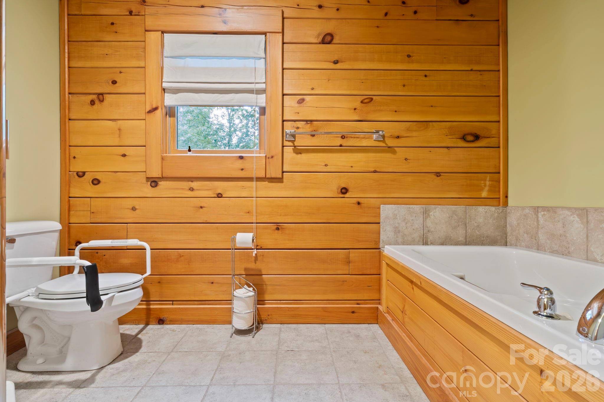 266 Rhododendron Drive Saluda, NC 28773 - Photo 16 of 35 a bathroom with a bathtub and sink