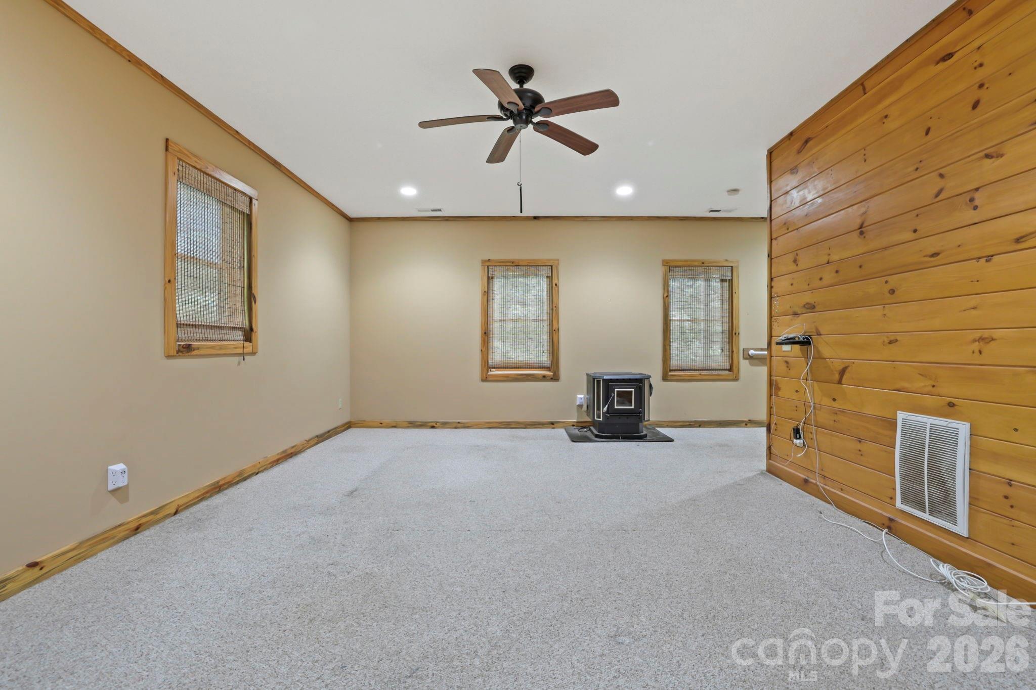 266 Rhododendron Drive Saluda, NC 28773 - Photo 25 of 35 an empty room with windows
