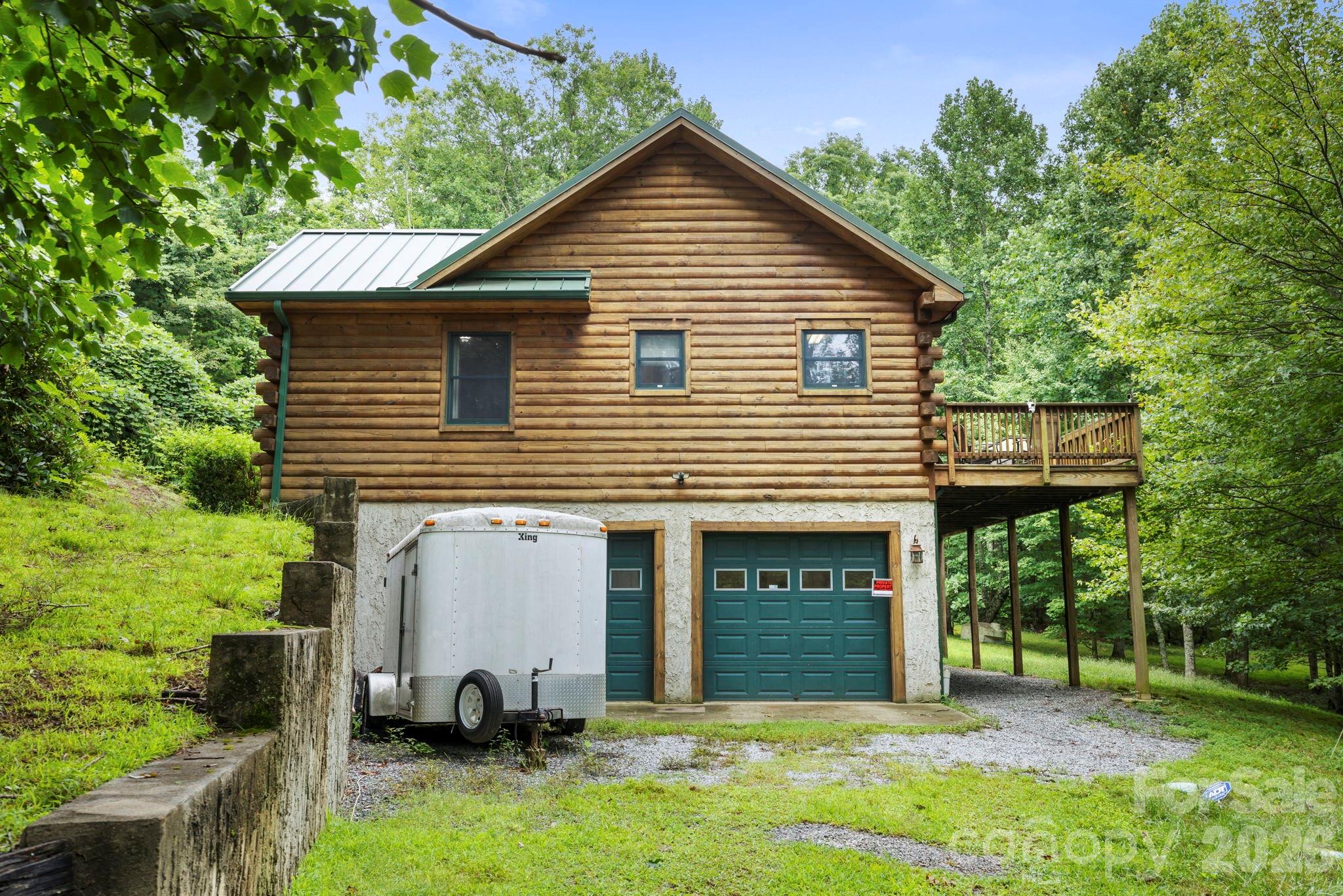 266 Rhododendron Drive Saluda, NC 28773 - Photo 30 of 35 a front view of a house with a yard