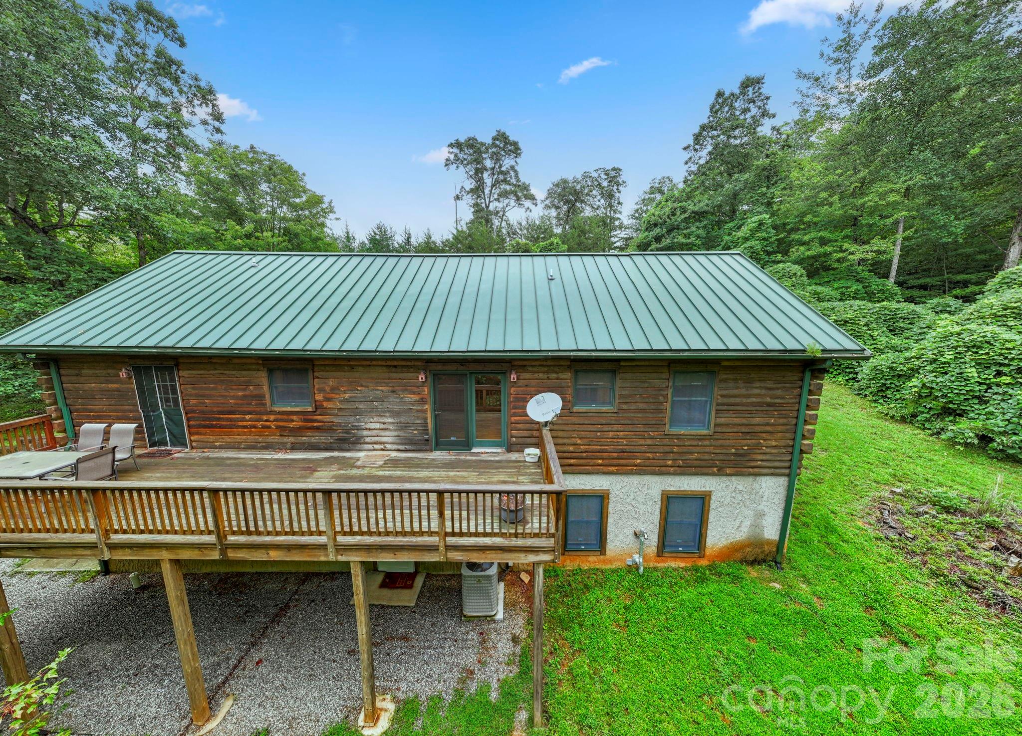 266 Rhododendron Drive Saluda, NC 28773 - Photo 3 of 35 a view of house with outdoor space and seating space
