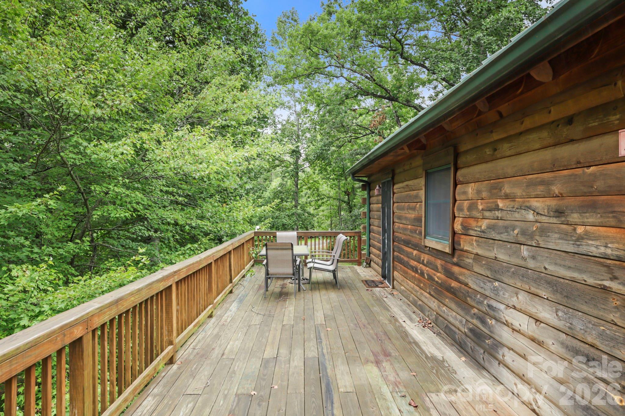266 Rhododendron Drive Saluda, NC 28773 - Photo 32 of 35 a view of balcony with wooden floor and seating space