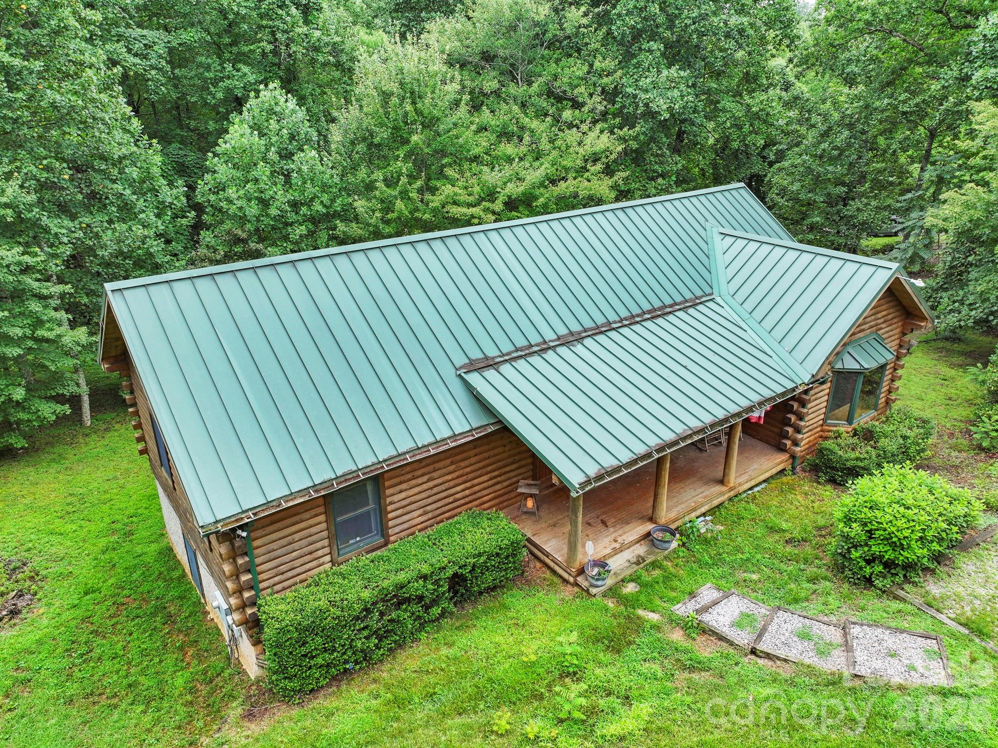 266 Rhododendron Drive Saluda, NC 28773 - Photo 33 of 35 a view of a backyard with wooden fence
