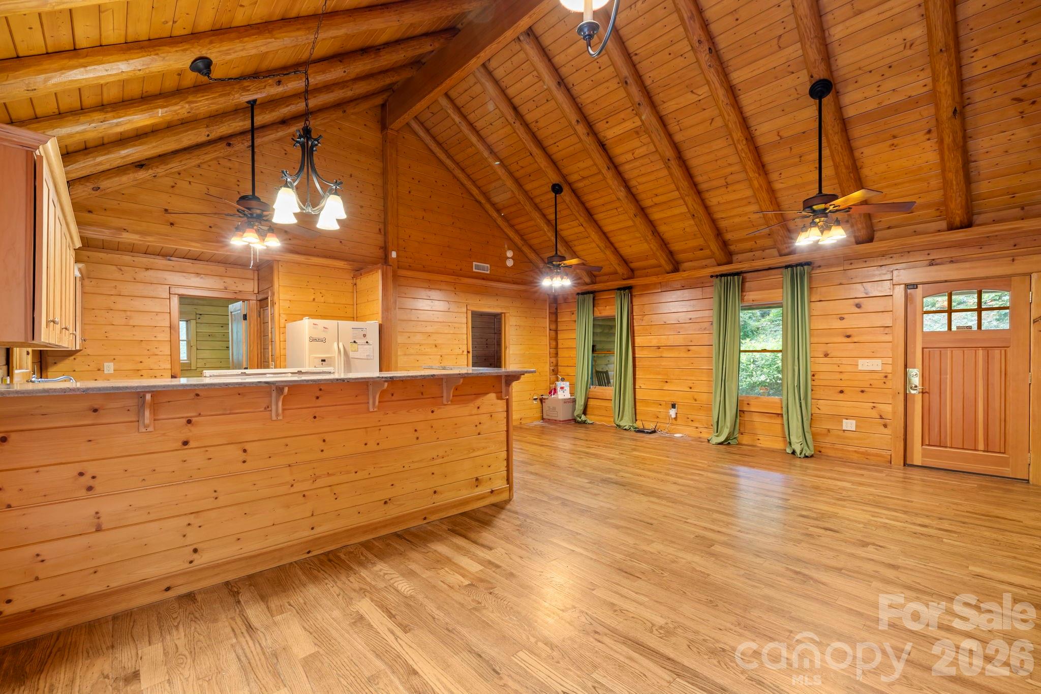266 Rhododendron Drive Saluda, NC 28773 - Photo 6 of 35 a view of a room with wooden floor