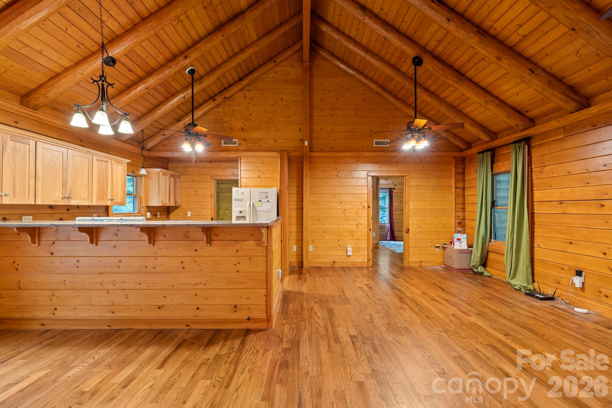 266 Rhododendron Drive Saluda, NC 28773 - Photo 7 of 35 a view of an empty room with wooden floor